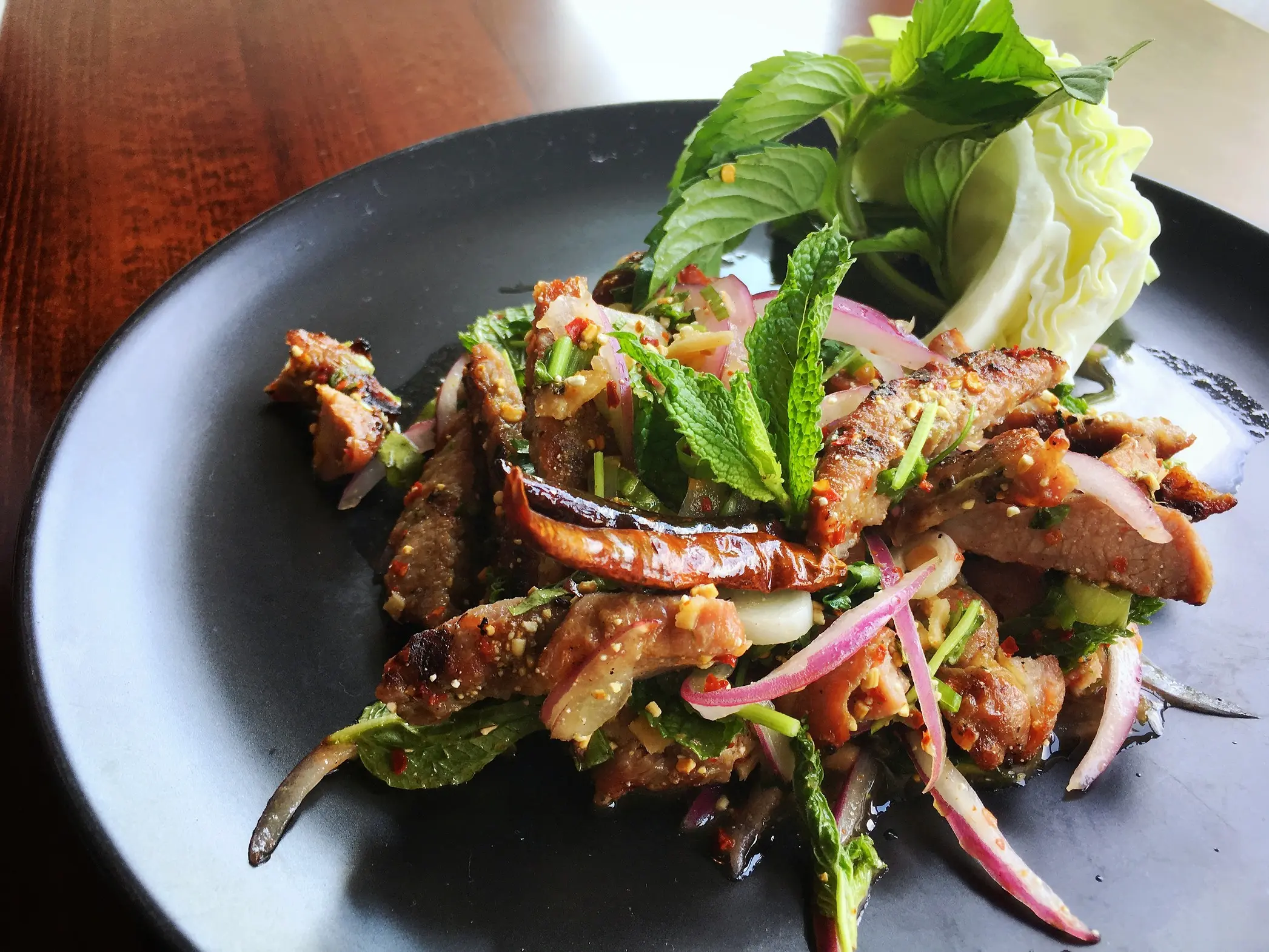 Close up shot of Moo Nam Tok salad.