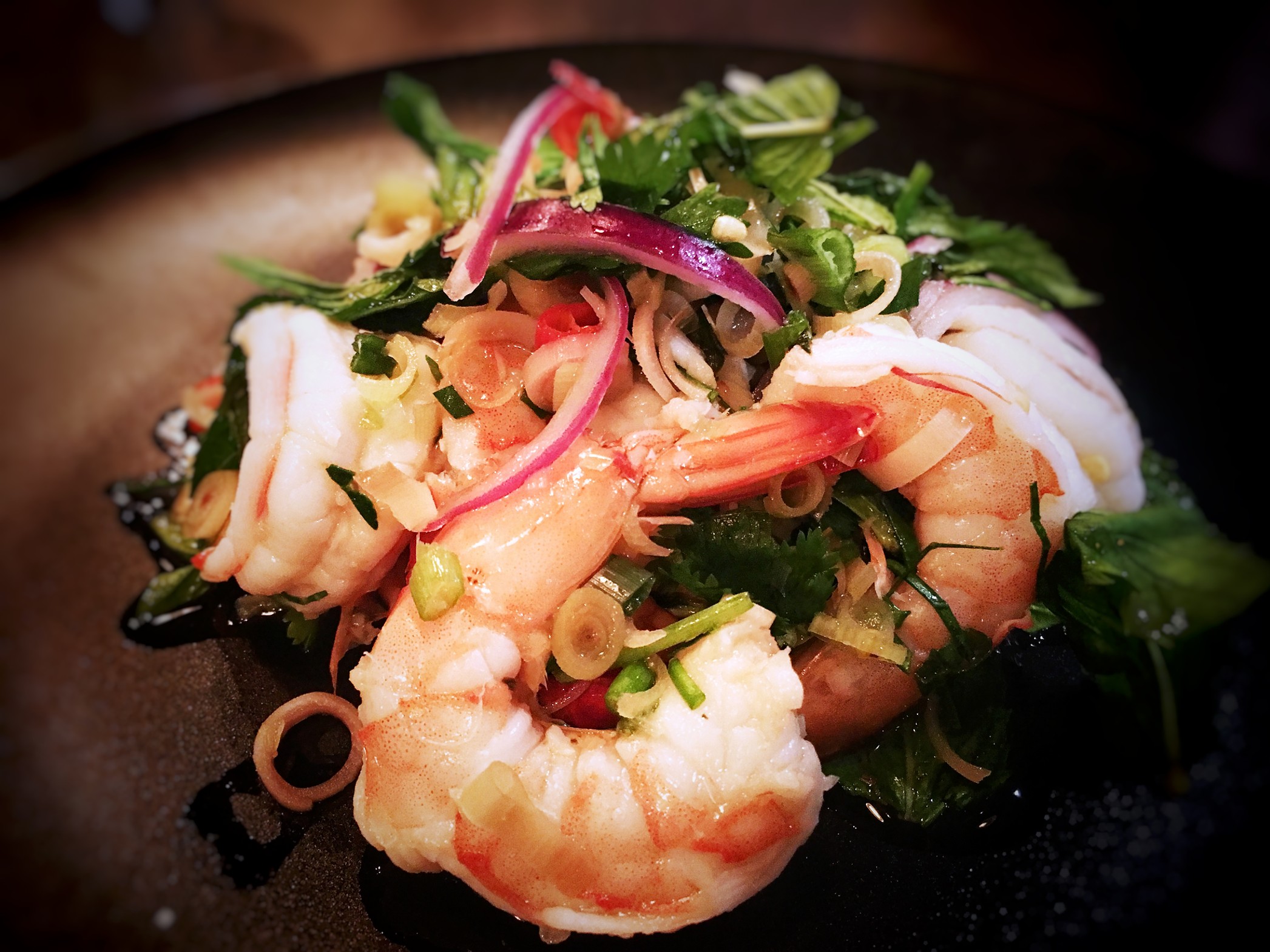 Close up of Pla Koong salad with shrimp.
