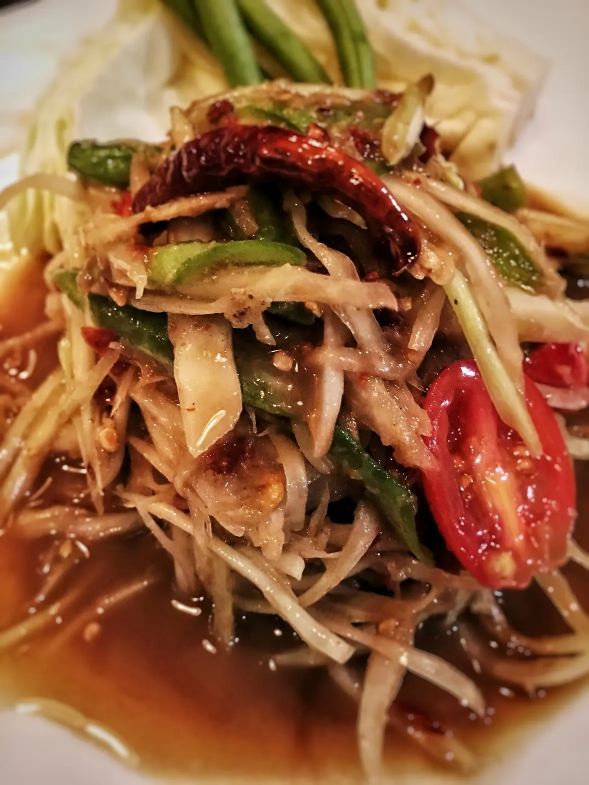 Close up of Somtum Plara papaya salad.