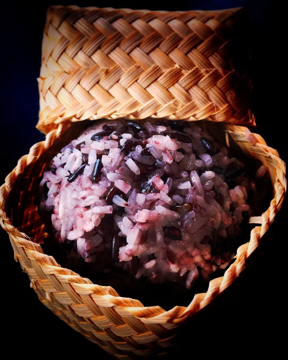 Close up of purple Sticky Rice in a serving basket.