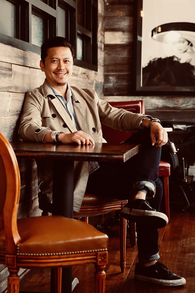 ESAAN Tumbar's owner, Tu Yutthpon, standing in his restaurant.